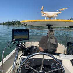 ESLA Drone Pic showing steering wheel of boat in water